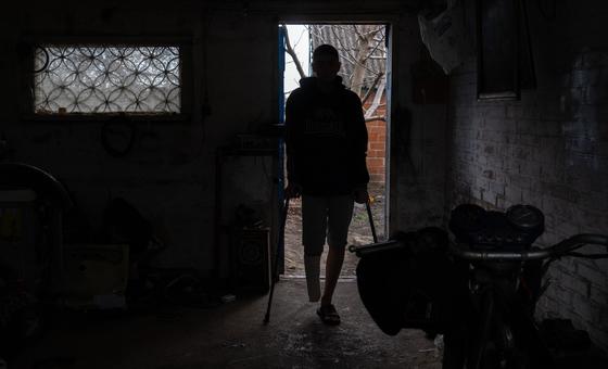 A 16-year-old boy, who lost his right leg in a landmine explosion and can no longer walks, stands on crutches at his house in Kharkiv, Ukraine. (file)